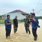 Keterangan Poto: Tim Damkar Pos Cicinde Selatan Karawang melaksanakan giat asesmen banjir di Cilamaya (istimewa)
