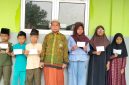 Keterangan Foto: Madrasah Diniyah Takmiliyah Ula (MDTU) Al Hidayah menyambut Tahun Baru Islam 1448 Hijriah dengan agenda rutin santunan anak yatim piatu
