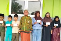 Keterangan Foto: Madrasah Diniyah Takmiliyah Ula (MDTU) Al Hidayah menyambut Tahun Baru Islam 1448 Hijriah dengan agenda rutin santunan anak yatim piatu